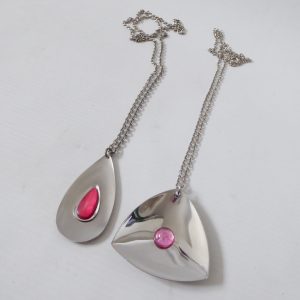 Vintage 1970s modernist stainless steel necklaces, retro red & pink pendants