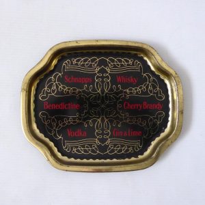 Vintage small drinks tray, shot glass, aperitif appetisers cocktails. Black gold