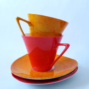 French porcelain cups & saucers, orange red spotty. Porcelaines Union Limousine