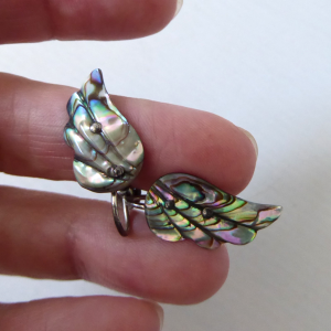 Vintage abalone shell wing shaped earrings, old screw on backs. Sterling metal