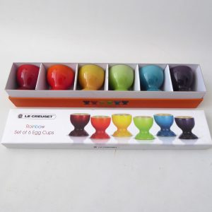 Set of 6 boxed Le Creuset Rainbow ceramic stoneware footed egg cups. Multicolour