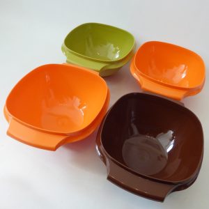 Tupperware Servalier set 4 bowls 840 vintage 1970s retro plastic. Harvest orange