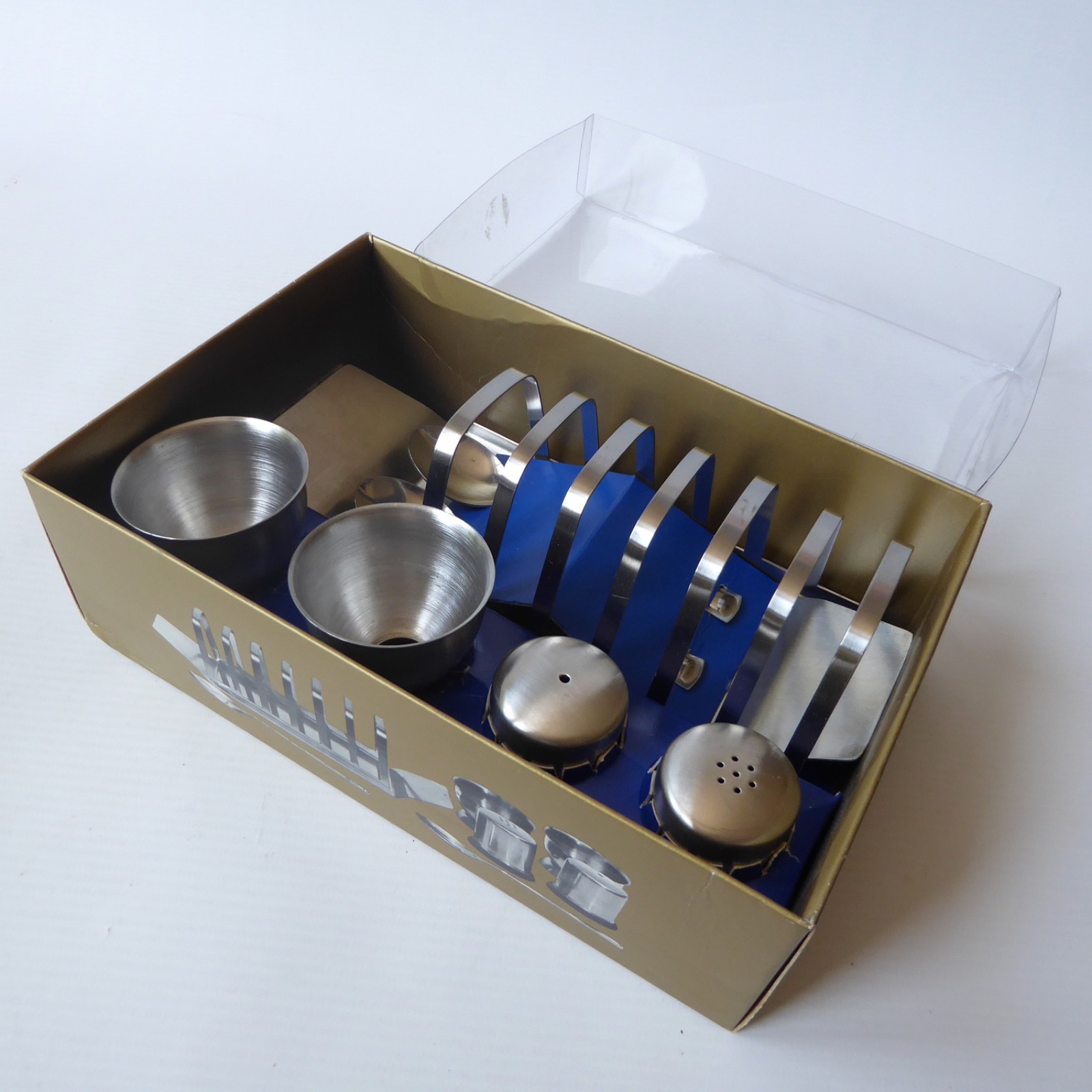 Boxed new 1970s breakfast set, egg cups, toast rack, salt pepper shakers, spoons