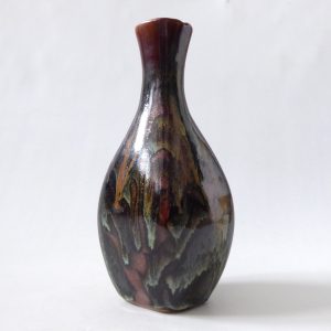Glazed vintage art pottery vase, studio. Black brown green drip, flat oval vase