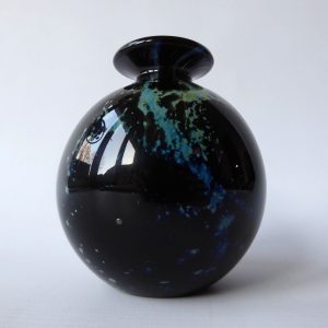 Vintage Phoenician black round globe art glass vase, blue gold bits. Signed 1988
