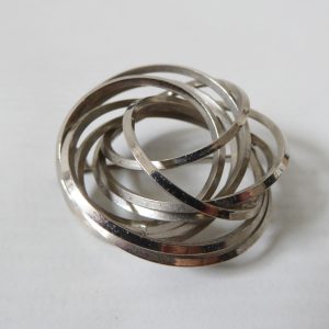Vintage brooch, spiral scramble silver tone open 3D knot. Retro 1970s modernist