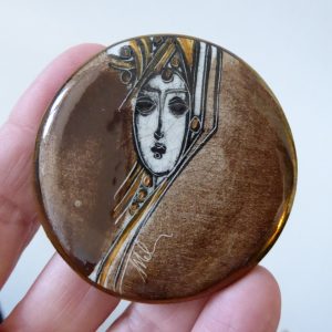 Ceramic hand painted & signed brooch, stylised woman portrait brown gold, round