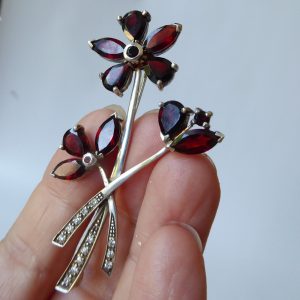 Vintage silver brooch & red glass or gemstone, rhinestone flowers. Czech garnet?