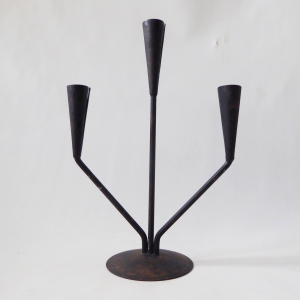 Retro black metal candle holder candlestick. Vintage modernist, dinner candle