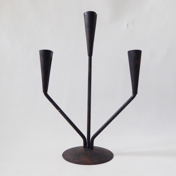 Retro black metal candle holder candlestick. Vintage modernist, dinner candle