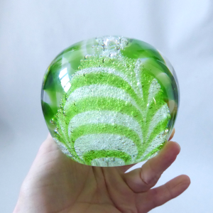 Big lime green, white & clear glass cased paperweight. Round chevrons + bubbles